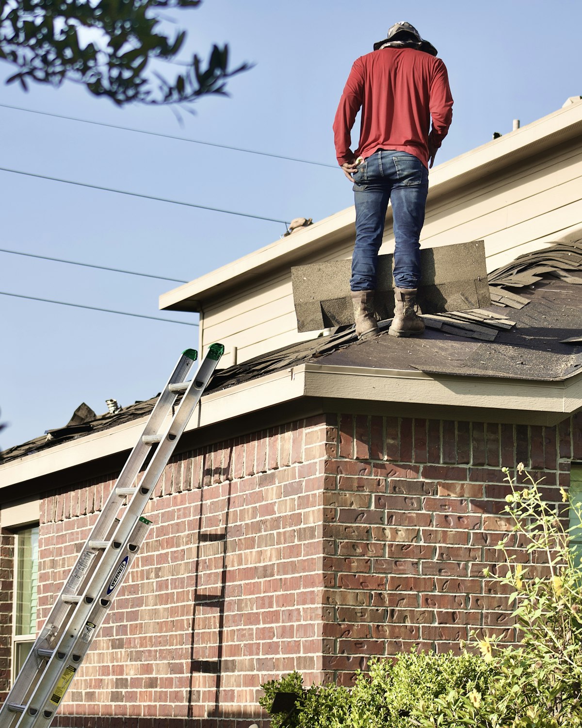 Roofing work in progress on a house